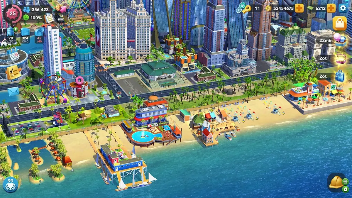 Pobřežní čtvrť v SimCity BuildIt s výškovými budovami a pláží